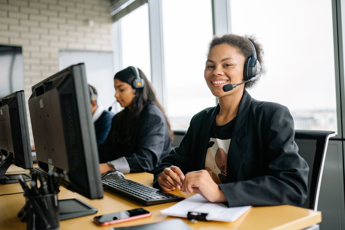 A patient coordinator working at a clinic front office