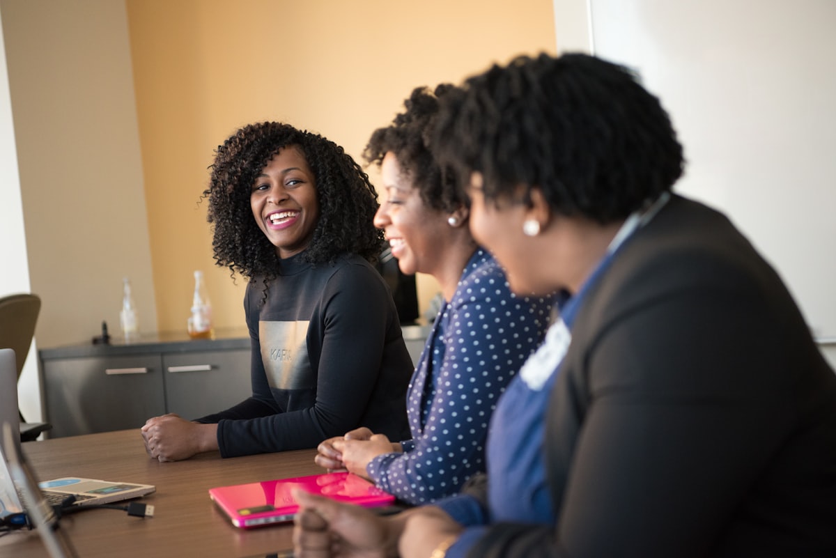 Diverse women smiling and talking together