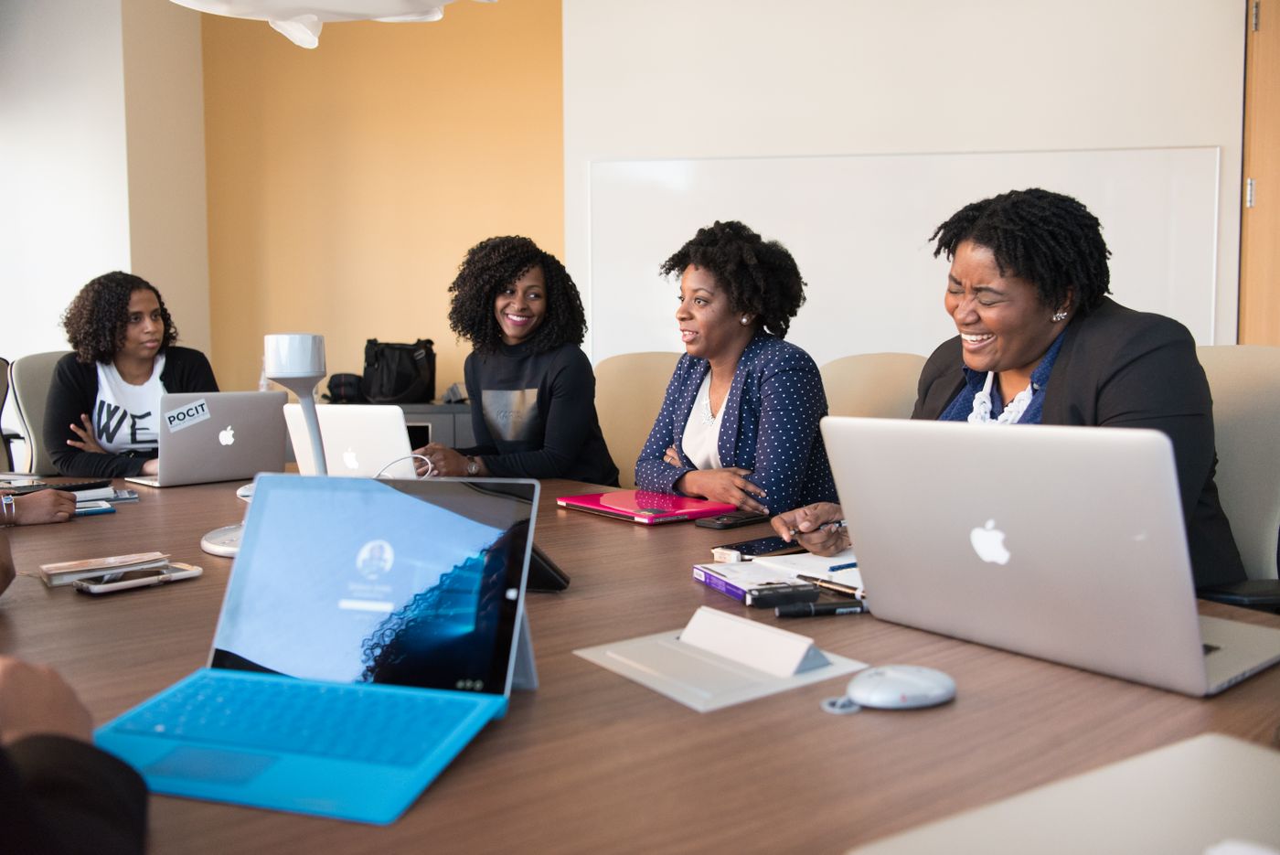 Professional women collaborating around a conference table