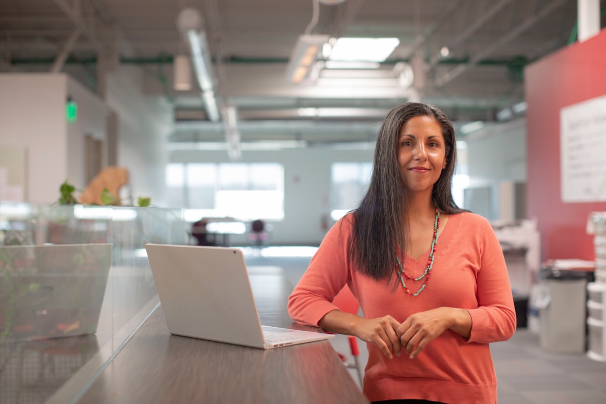 A confident professional woman in a modern workplace